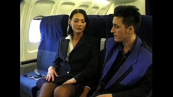XXX Brunette beauty wearing stewardess uniform gets fucked on a plane megaputki